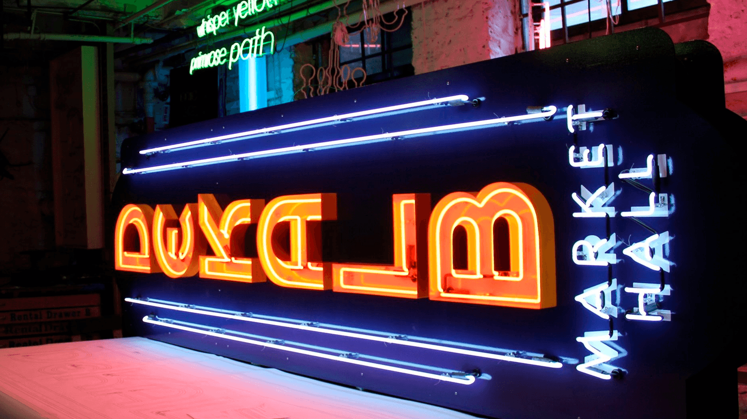 DMH Neon Sign on Table